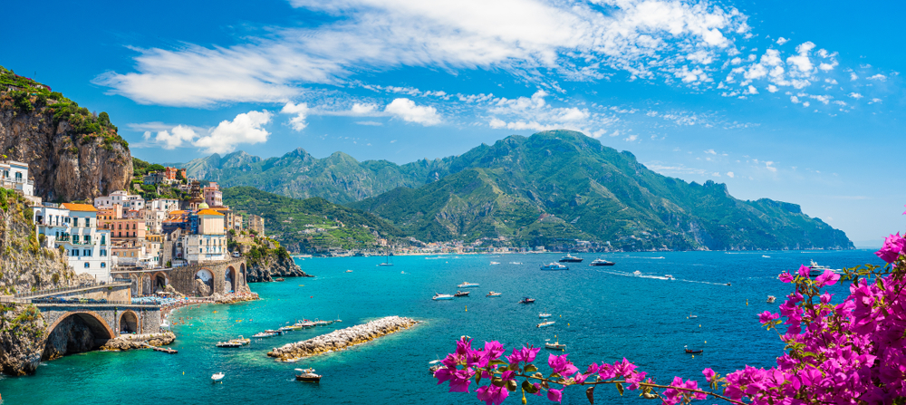 Beautiful coastal town with flowers and Mountains Landscape with Atrani town at famous amalfi coast, Italy. Example of 16:9 aspect ratio.