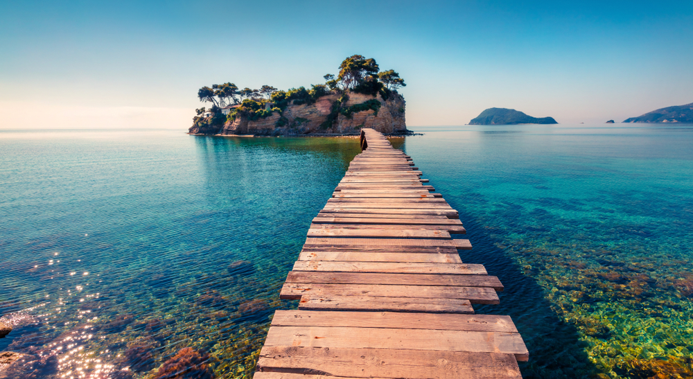 Bright spring view of the Cameo Island. Picturesque morning scene on the Port Sostis, Zakinthos island, Greece, Europe. Beauty of nature concept background.