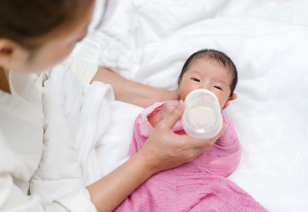 Mother Feeding Newborn baby