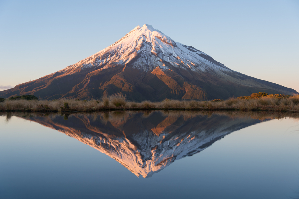 Beautiful reflection mountain and blue lake, Taranaki, New Zealand.