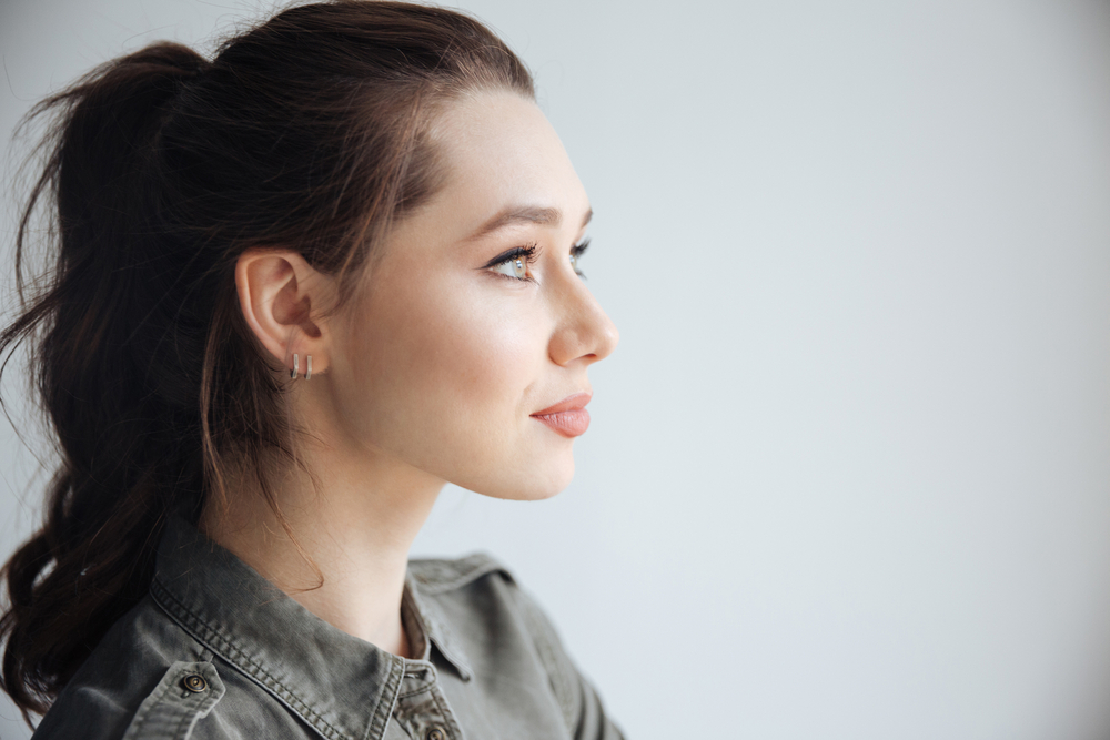 Profile of a Woman in a grey shirt