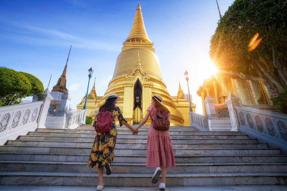 Two asian women traveling Grand Palace and Wat phra kaew Bangkok city,Thailand