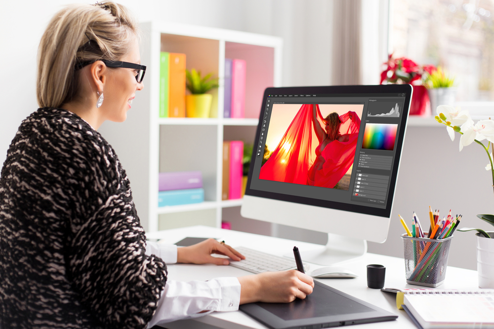 Woman editing photos on computer