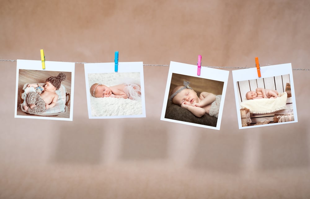 newborn photos attached clothespins on rope