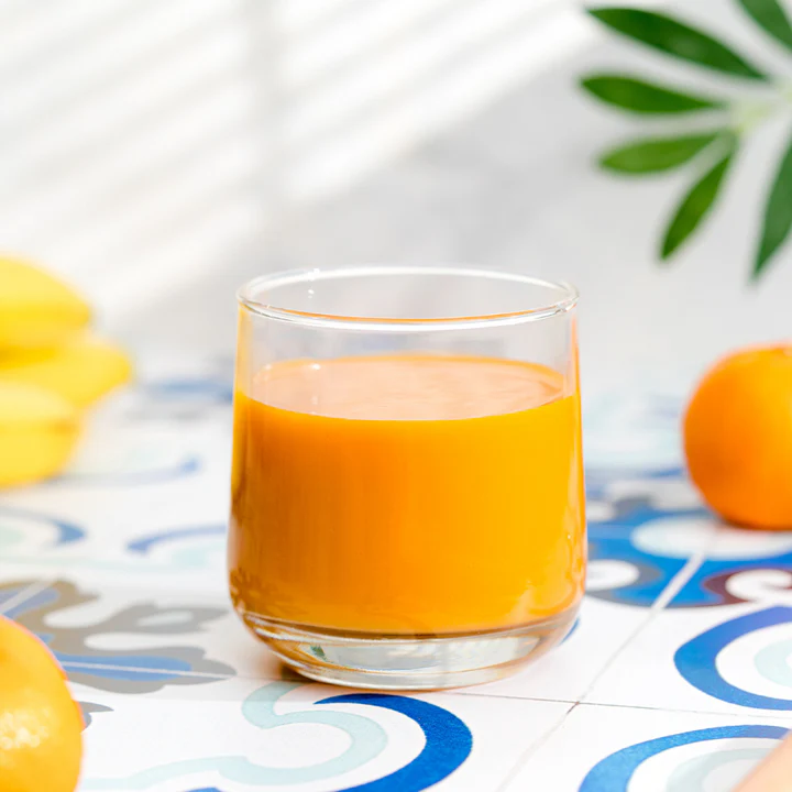 orange juice on light food photography backdrop from best ever backdrops