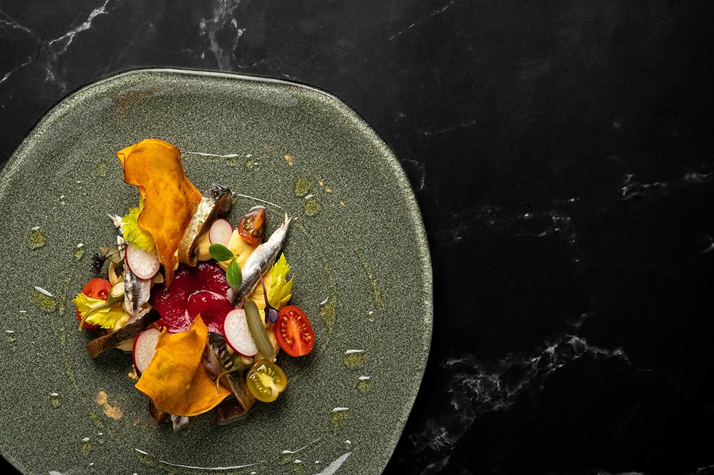 plate of food on a black table