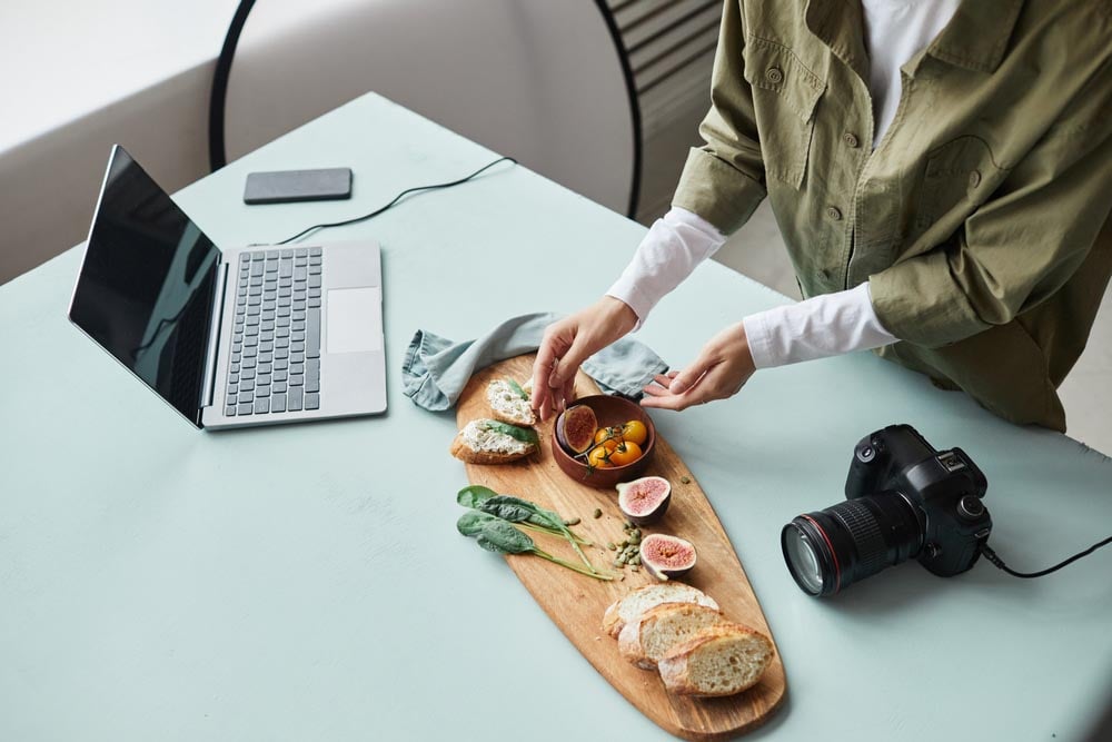 https://www.shutterstock.com/image-photo/high-angle-view-female-food-photographer-2133698401