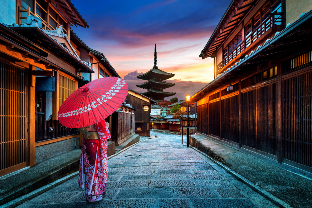 Asian woman wearing japanese traditional kimono at Yasaka Pagoda and Sannen Zaka Street in Kyoto, Japan.