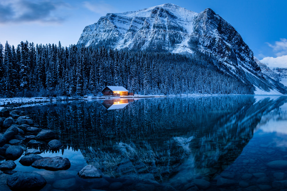 blue hour mountain lake cabin